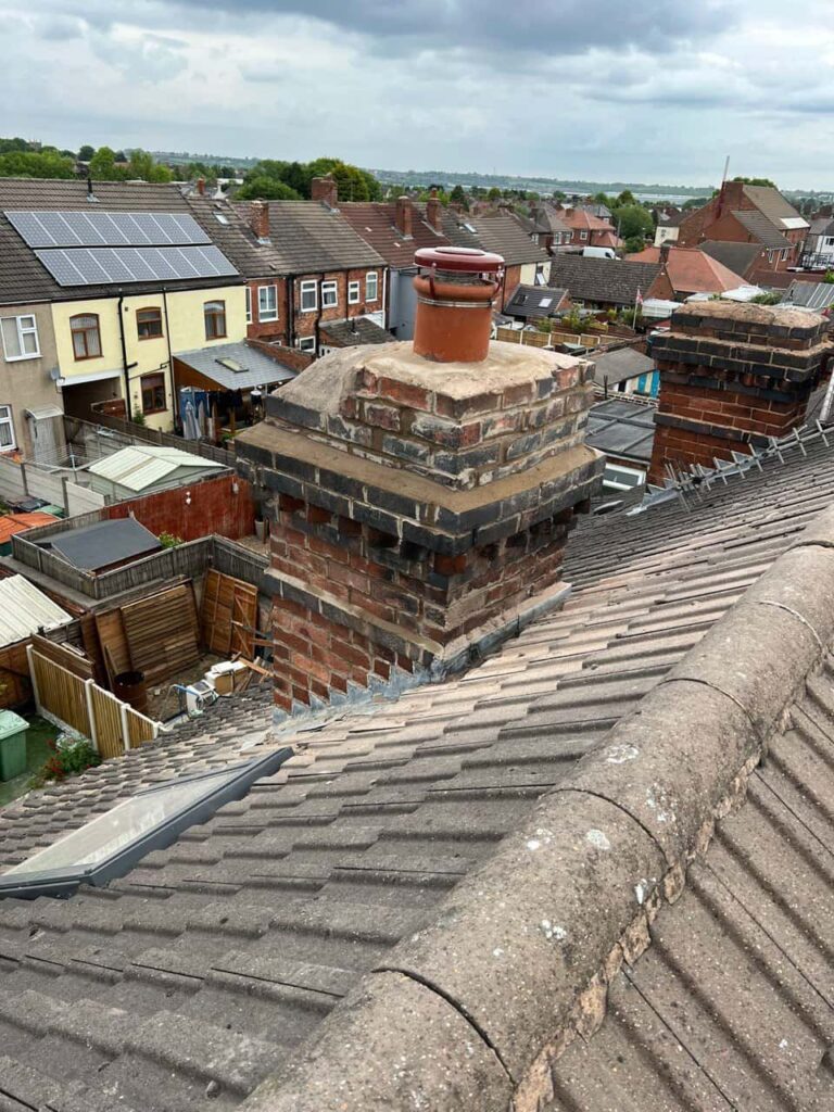 This is a photo taken from a roof which is being repaired by Lingfield Roofing Repairs, it shows a street of houses, and their roofs